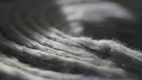 Closeup-Of-Recycled-Textiles-With-Soft-Fibers-Being-Produced,-Manufacturing-Industry