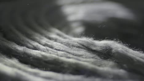 closeup of recycled textiles with soft fibers being produced, manufacturing industry