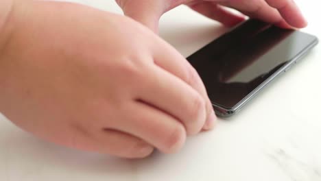 close-up of disconnect charging connection to smartphone usb-c port