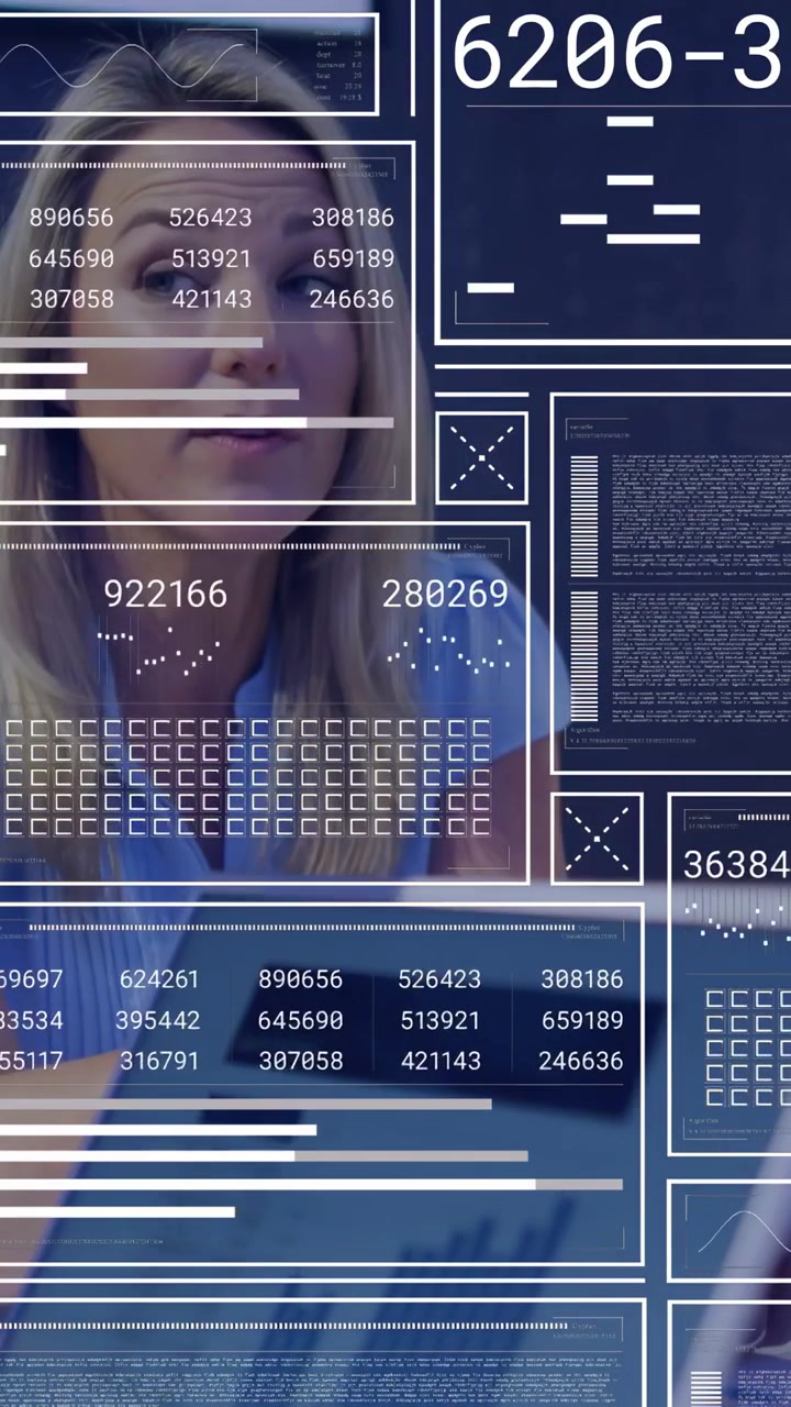 Vertical video: Woman analyzing laptop as colleague handing papers and HUD animating business data