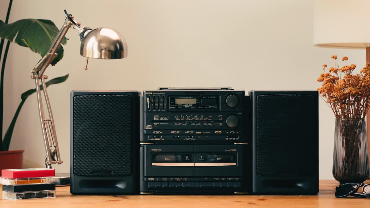 Retro radio tape recorder, audio cassette close-up. Listening to music, old radio boom box player, macro of vintage music listening. . High quality 4k footage