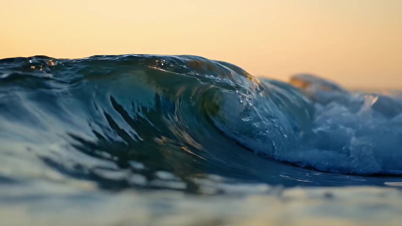 Ocean Wave Breaking at Sunset
