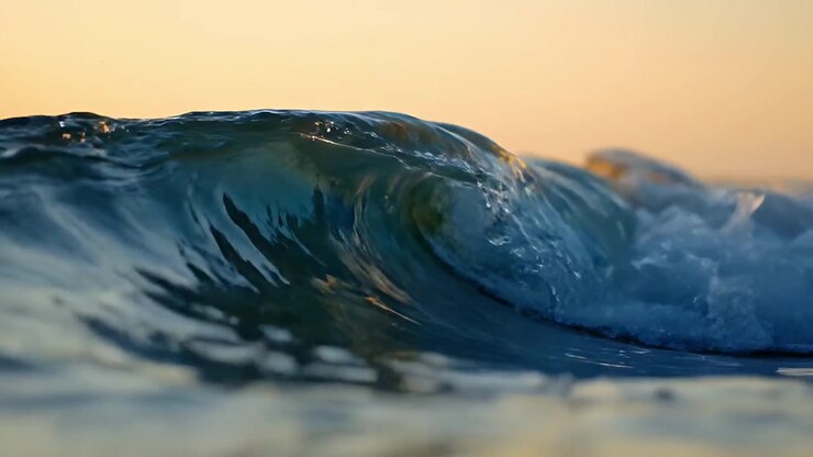 Ocean Wave Breaking at Sunset