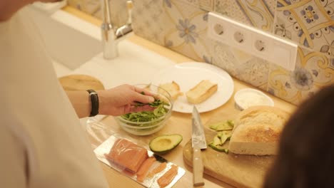 loving couple making a sandwich in kitchen-living room