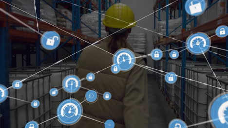 animation of connected icons, biracial female worker pulling manual trolley in warehouse