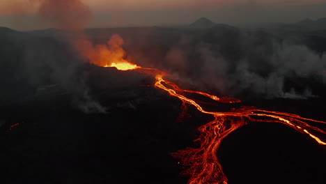 Slide-and-pan-footage-of-lava-show-at-active-volcano-eruption.-Flowing-molten-lava-stream.-Fagradalsfjall-volcano.-Iceland,-2021