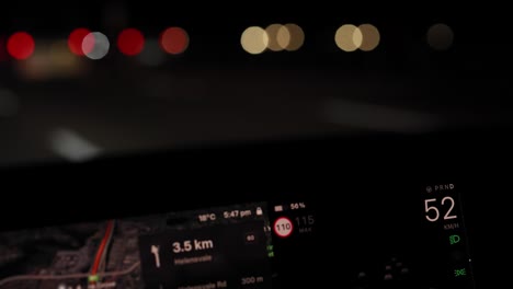 car dashboard and bokeh lights at night