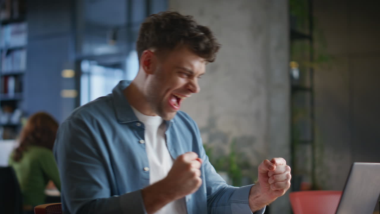 Focused employee examining documents in office closeup. Joyful successful man
