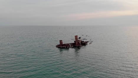 Drone-Video-shipwreck-Blue-sea-waters-sunset-Greece