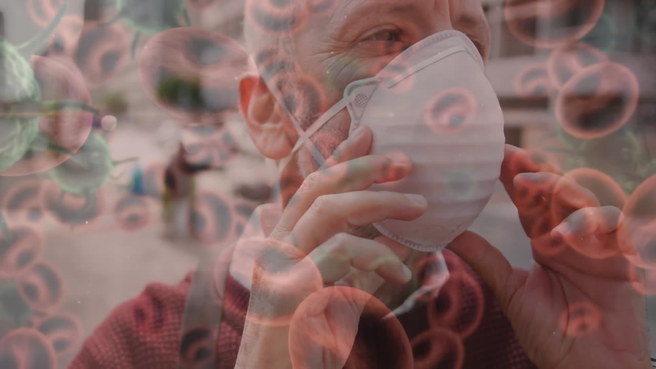 코로나19 세포가 얼굴 마스크를 쓰고 있는 사람을 가로질러 움직이는 애니메이션