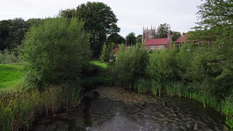 Aerial-video-footage-of-the-remains-of-Bolingbroke-Castle-a-13th-century-hexagonal-castle,-birthplace-of-the-future-King-Henry-IV,-with-adjacent-earthwork