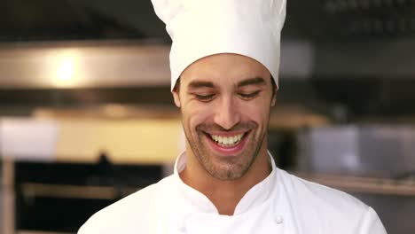 Handsome-chef-smelling-dish-and-doing-ok-sign