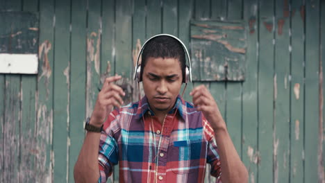 slow motion portrait of mixed race man listening to music