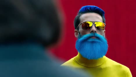 stylish man with blue hair and beard