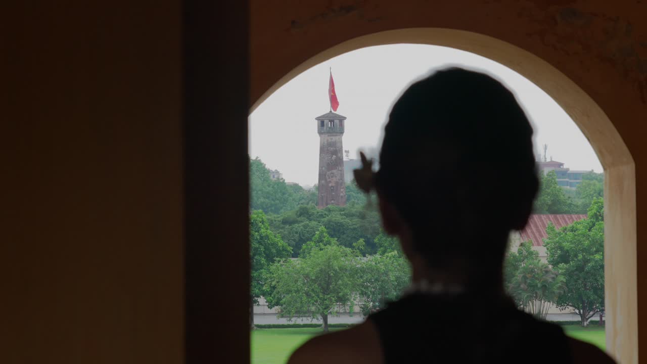 Overlooking Vietnam Socialist Republic communist country flag yellow star red background tower top