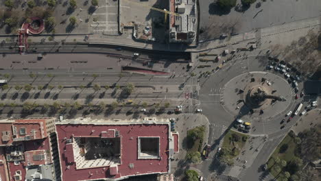 Top-down-descending-footage-of-wide-multilane-boulevard-near-Columbus-Monument-in-centre-of-city.-Barcelona,-Spain