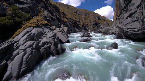 rushing river through a rocky mountain gorge
