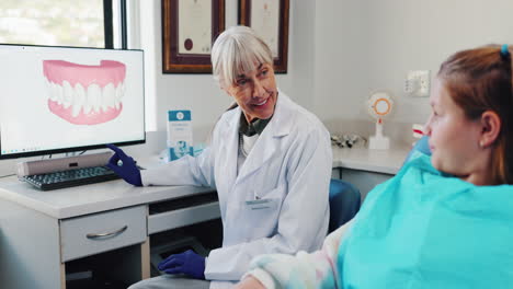 dentist explaining dental scan to patient