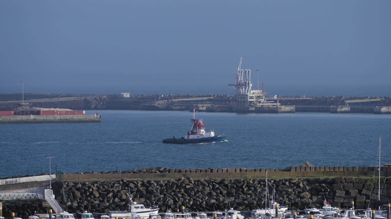 Ship&#x27;s boat leaving the port of Sines, Portugal