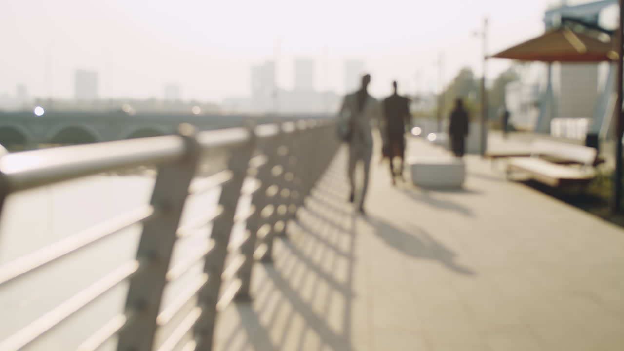 Business People Walking on Embankment