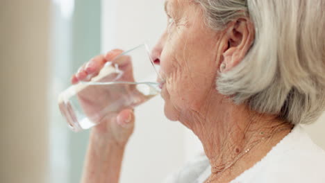 Healthy,-hydration-and-senior-woman-drinking-water