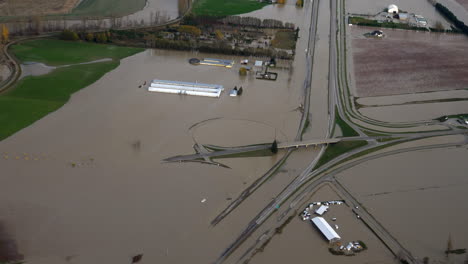 floodwaters cover highway and fields due to heavy rains in abbotsford, british columbia, canada