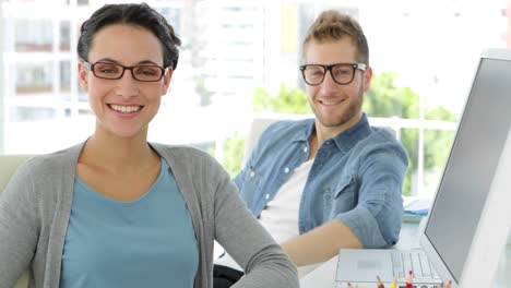 Lovely-smiling-coworkers-looking-at-camera-