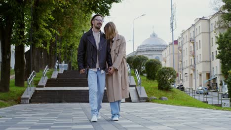 couple walking in an autumn city park