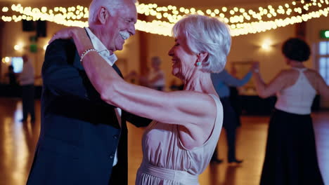 senior couple dancing at a party