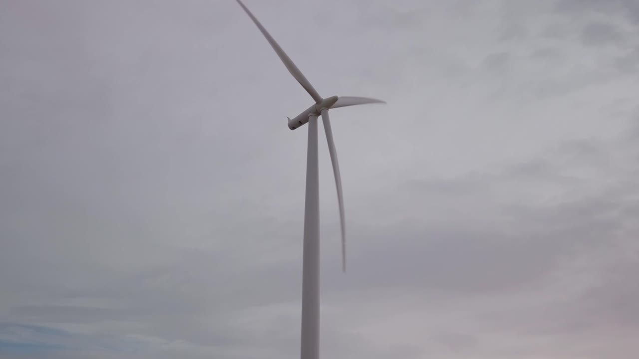 Wind Turbine in Cloudy Sky