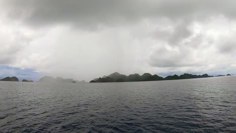 distant remote tropical island in a rain storm