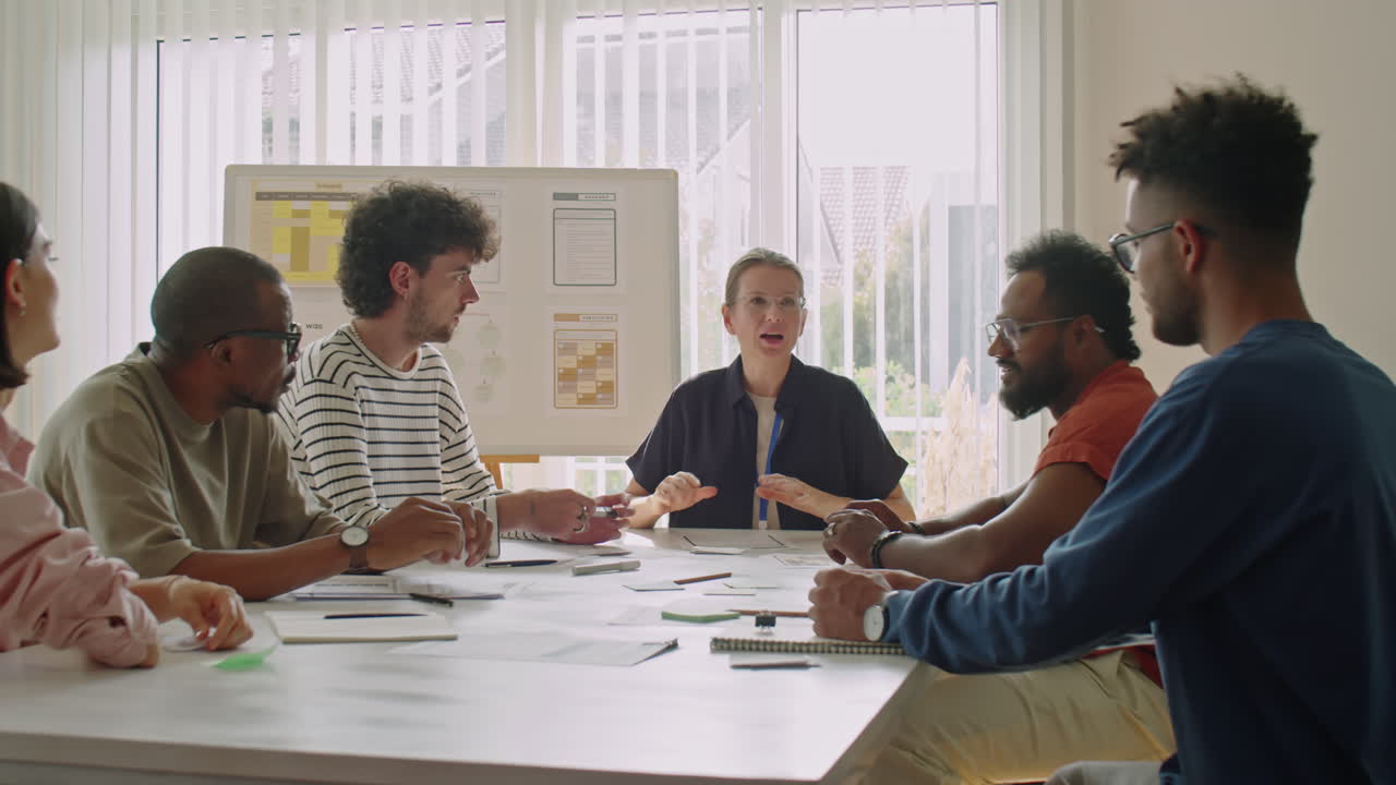 Female Teacher and Group of Multi-Ethnic Students during Lesson
