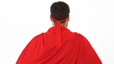 rear view of man pretending to be a super hero