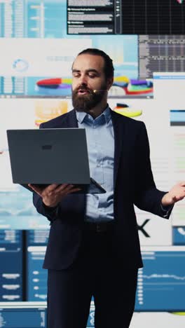 vertical video male public speaker and business coach leading a dynamic presentation