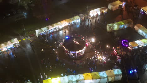 Drone-view-of-Christmas-stalls-and-carousel-on-the-Podgorski-Square-with-St