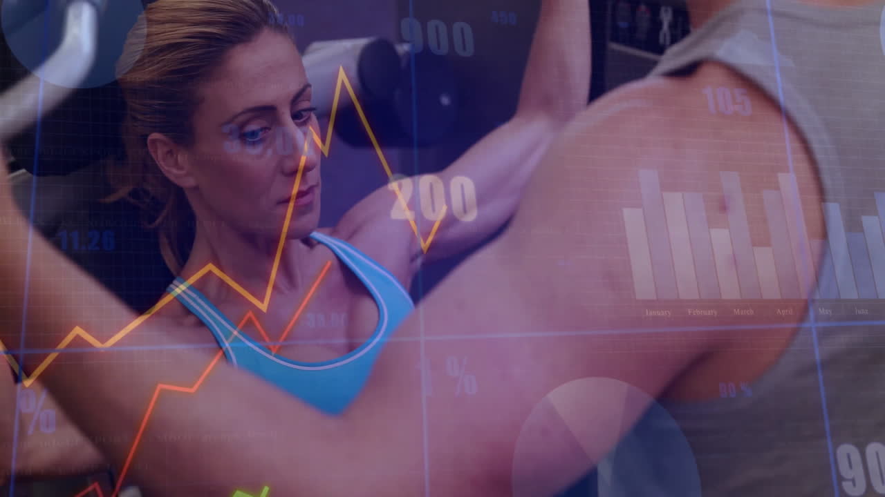 Trainer spotting client pushing chest-press in health gym, with live data charts showing progress