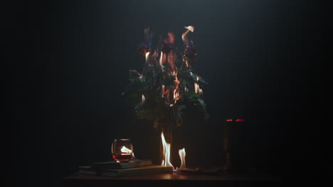 roses burning in flames on the table