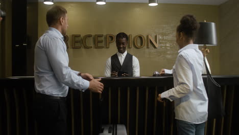 receptionist talking with guests