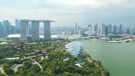 bright-Singapore-morning-skyline-aerial-shot-with-focus-at-Marina-bay,-gardens-and-skyscrapers