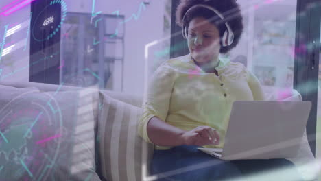 animation of data processing on screens over african american businesswoman in office