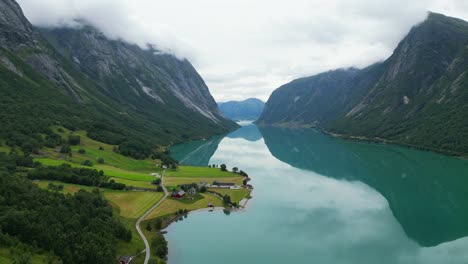 norway fjord - turquoise blue jolstravatn lake and small farm village sygnesand at sunnfjord, vestland - aerial