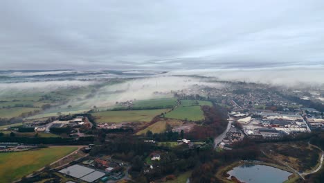 Aerial-footage-of-a-small-town-in-the-morning-mist