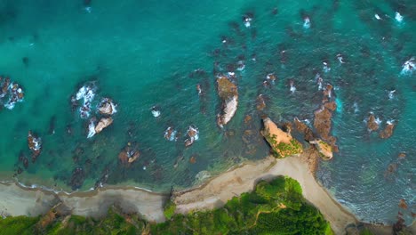 coastal aerial view of beach and rocky shore