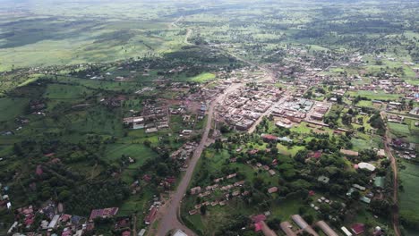 small valley town under kilimanjaro kenya, aerial view of loitokitok near border with tanzania, 60fps drone shot