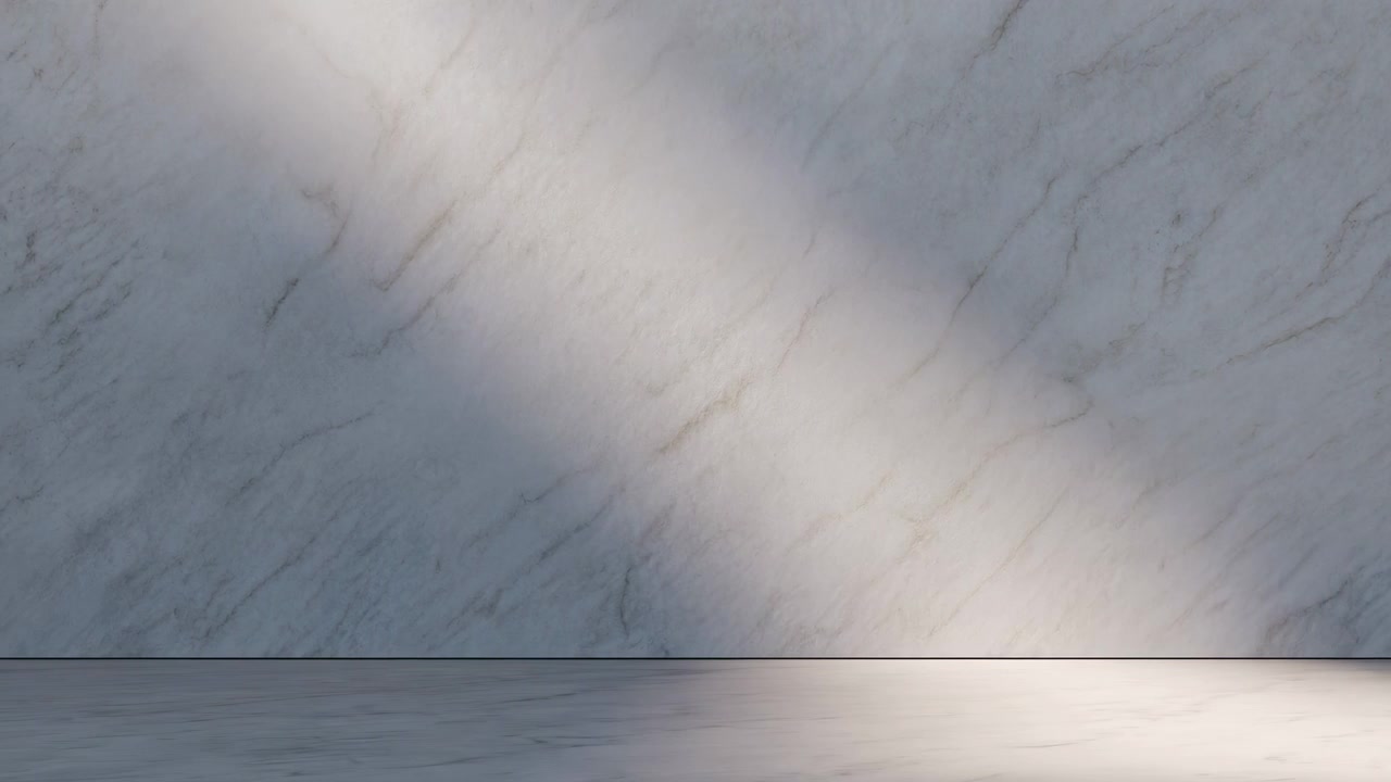 Centered empty interior with a light gray marble wall and matching floor, lit by a soft diagonal sunbeam from the upper left and a bright glow along the lower