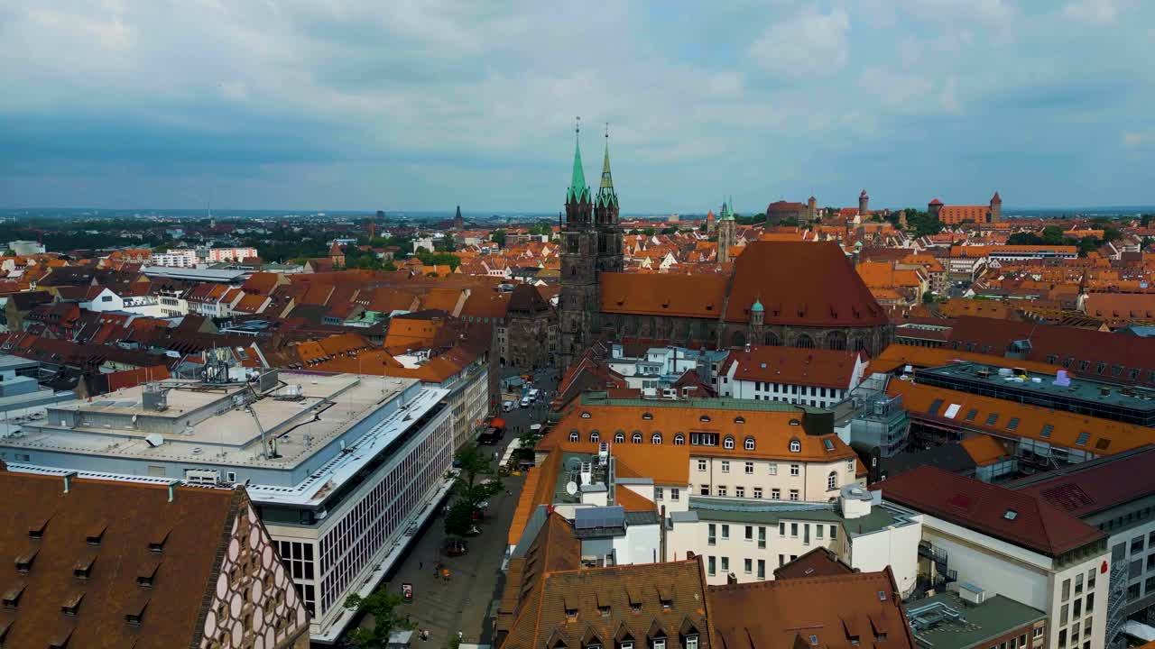 4K Aerial Drone Video of Copper-clad Spiers and Tiled Roof of St. Lawrence Church in Downtown Nurnberg, Germany