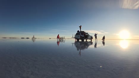 friends enjoying the view at salar de uyuni lake in bolivia