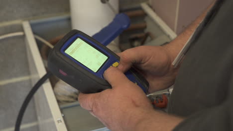 a central heating checking device is used by an engineer