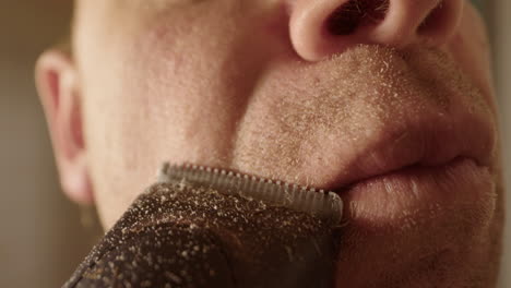 slow motion, macro wide, a man shaving with clippers