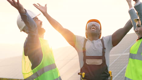 three happy multiethnics engineers raising their hands up on solar plantation